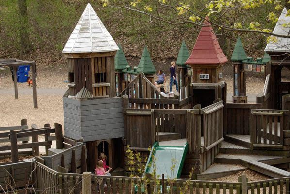 stairs, slides and walkways run among the tower-like structures of the playground