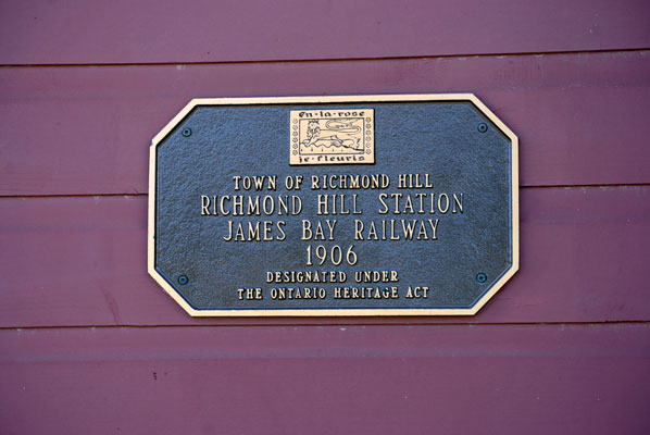 photo of the railway station historic plack which displays the following text: Town of Richmond Hill - Richmond Hill Station - James Bay Railway - 1906 - designated under the Ontario Heritage Act